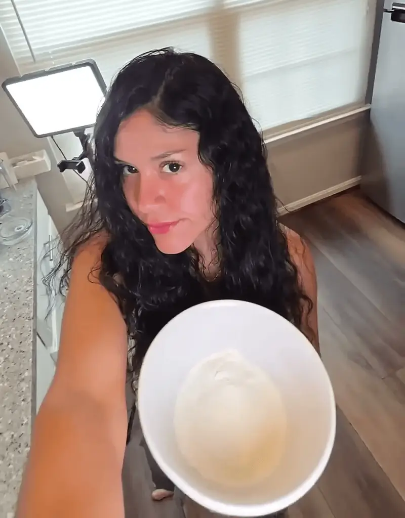 Crystal holding a bowl with the mixed Greek yogurt dough