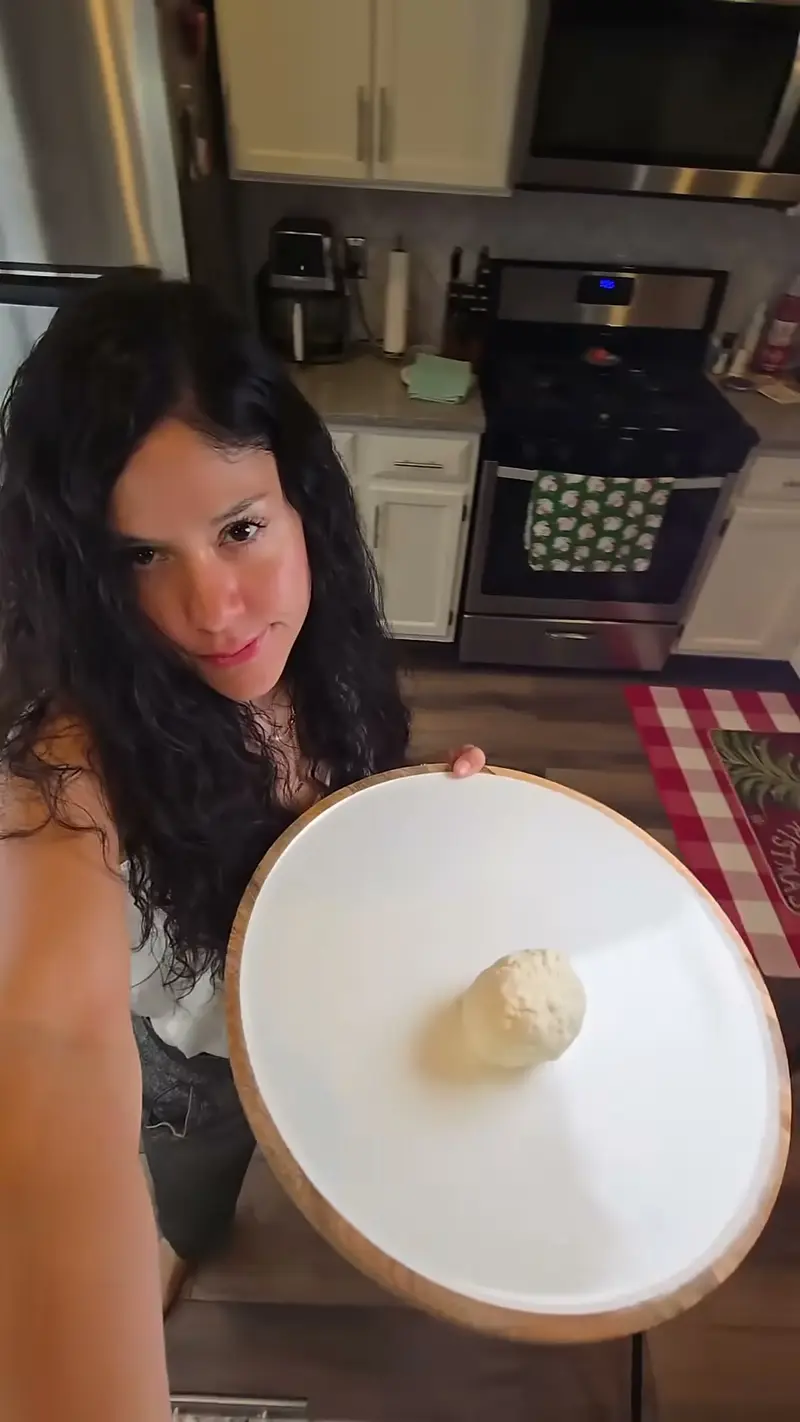 Crystal showing a single ball of crescent roll dough on a wooden board