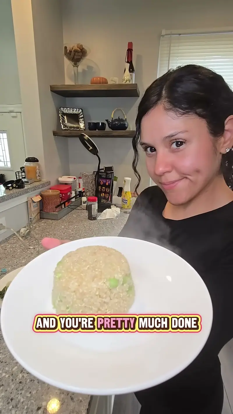 Crystal holding up a plate of the finished quinoa